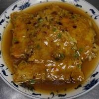 124. Char Siu Egg Foo Yung · Char Siu, bean sprouts, cabbage, green peas, and carrots mixed with eggs and serve with brow...
