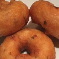 Meduvada · 3 pieces of Donut-shaped Indian crispy fritters made with spiced urad dhal batter. Served wi...