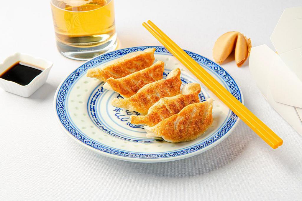 Potstickers (Pork + Veggie) · 6 Pan fried crispy dumplings with housemade dipping sauce