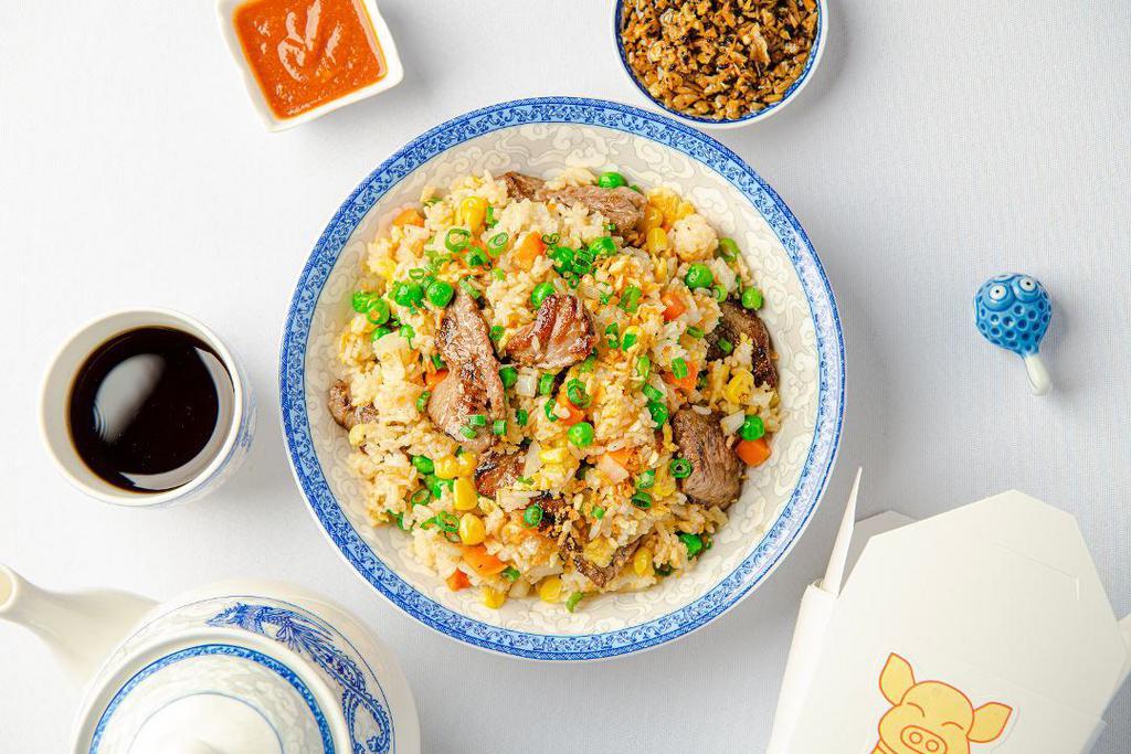 Fried Rice (Beef) · Golden fried rice with flank steak, eggs, onions, peas, carrots, and scallions. Gluten-free