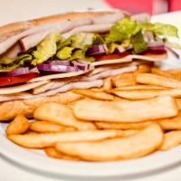 Turkey Breast & Provolone Sandwich · With mayonnaise and mustard, sliced turkey breast, lettuce, tomatoes, red onions, and Provol...