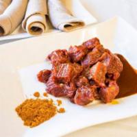 Gored Gored · Chunks of raw meat served with Ethiopian butter and awaze.