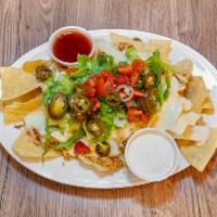 BBQ Nachos · Your choice of smoked chicken, pulled pork, or brisket. Topped with queso, lettuce, tomato, ...