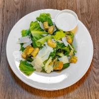 Caesar Salad · Romaine lettuce, shaved Parmesan, seasoned croutons and Caesar dressing.