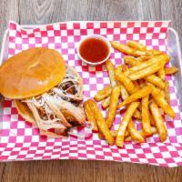 Smoked Pulled Pork Sandwich · Hickory smoked pork on a toasted bun.