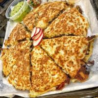 Meat Quesadilla · Meat, flour tortilla, and melted cheese.