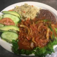 Bistec Salvadoreño · Grilled steak topped with tomato sauce served w/ rice, beans and salad