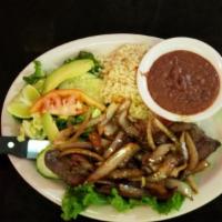 Higado Encebollado · Grilled beef liver topped with onions, served w/ rice, beans and salad