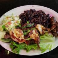 Churrasco Salvadoreño · Grilled steak, 3 shrimp, sausage, mixed rice & beans, and cabbage salad