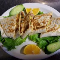 Super Quesadilla · Grilled flour tortilla filled w/ cheese, sour cream, salsa, avocado, and your choice of meat