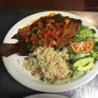 Mojarra Ranchera · Fried whole fish topped with ranchera sauce served w/rice and salad