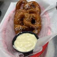 Soft Pretzels · 3 giant pretzel knots, hot hand-salted, served with our house hot cheese. Vegetarian.