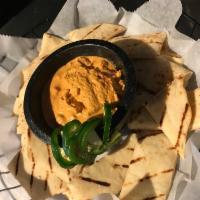 Roasted Red Pepper Hummus · Served with pita bread. Vegetarian.
