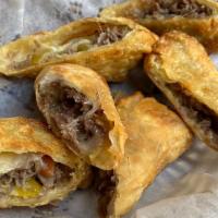Italian Beef Rolls · Three hand-wrapped egg rolls, stuffed with savory Italian beef and giardiniera, served with ...