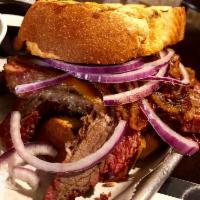Rustic Brisket Sandwich · A healthy portion of our house-prepared brisket spun in
our own brisket sauce on Texas toast...