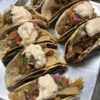 Street Tacos · Choose from our own beer-infused chicken, pork, ground beef or vegan, vegetarian option on c...