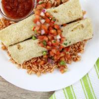 Black Bean Enchiladas · Two whole grain tortillas filled with black beans and corn atop a bed of spanish rice. Toppe...