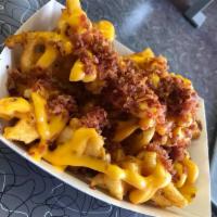 Loaded Curly Fries · Large curly fries with topped with bacon and melted cheese. 