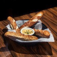 Bavarian Pretzel Bread Stick · 4 served with house-made queso and spicy brown mustard.