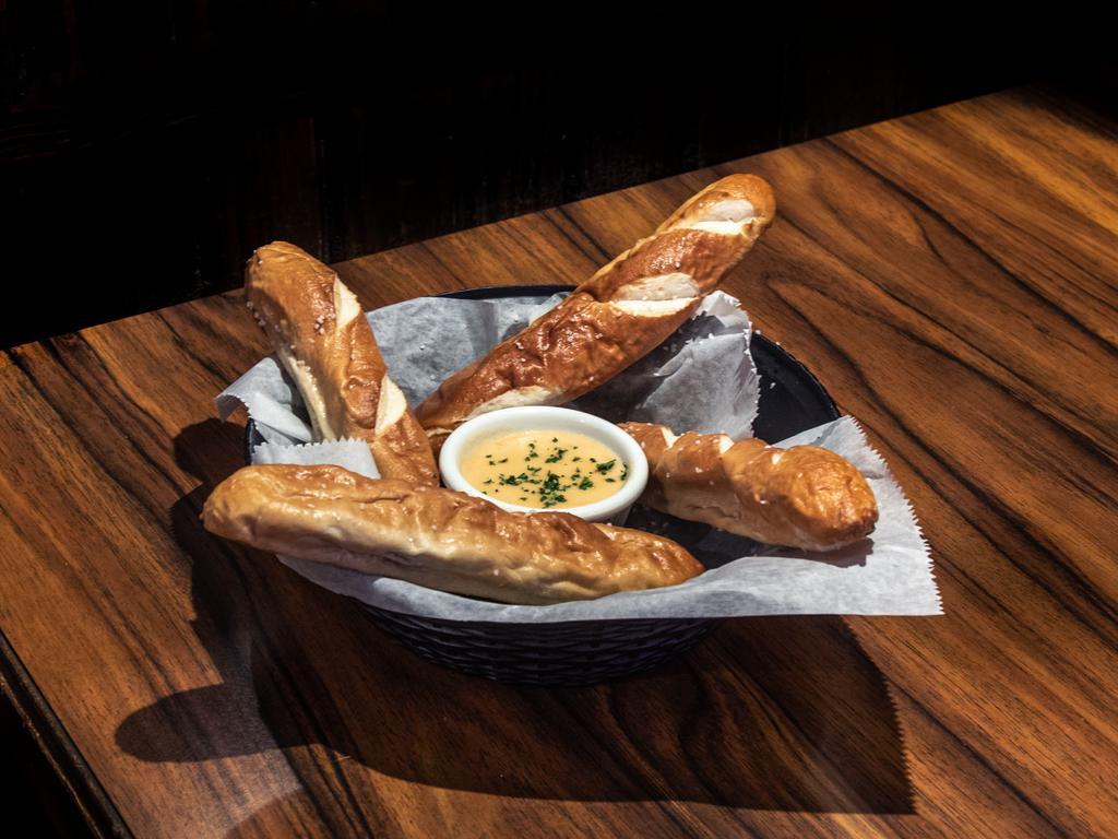 Bavarian Pretzel Bread Stick · 4 served with house-made queso and spicy brown mustard.