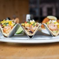 Mango Shrimp Tacos · Fins' favorite. Tequila-lime shrimp, cabbage, mango jalapeno salsa, Cotija, Fins' key lime a...