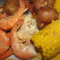 Steam Shrimp Bag · One dozen of large shrimp steamed, and tossed in our garlic butter, and served in a bag with...