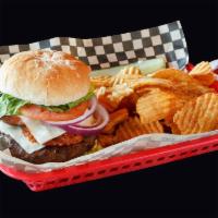 Bacon Burger · Topped with crisp bacon and American cheese. Served with chips, a pickle, lettuce, tomato an...