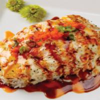 Dynamite Crazy Philly  · We top a Deep Fried Philadelphia Roll in our house-special baked Scallop and crab meat sauce...