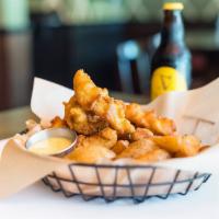 Harp Battered Chicken Tenders · Comes with chips and honey mustard sauce.
