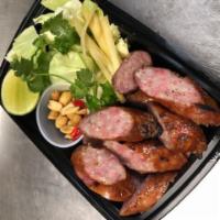 Isaan Sausage · Northeast Thai fermented sour sausage, made with pork and rice, served with fresh chilis, ra...