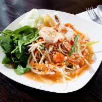 Som Tum Thai Salad · Papaya salad with tomatoes, green beans, shrimp and peanuts. Includes salted baby crab for a...