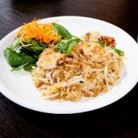 Bangkok Pad Thai · Thai style spicy pan-fried rice noodles with ground chicken, shrimp, fried tofu, egg, green ...