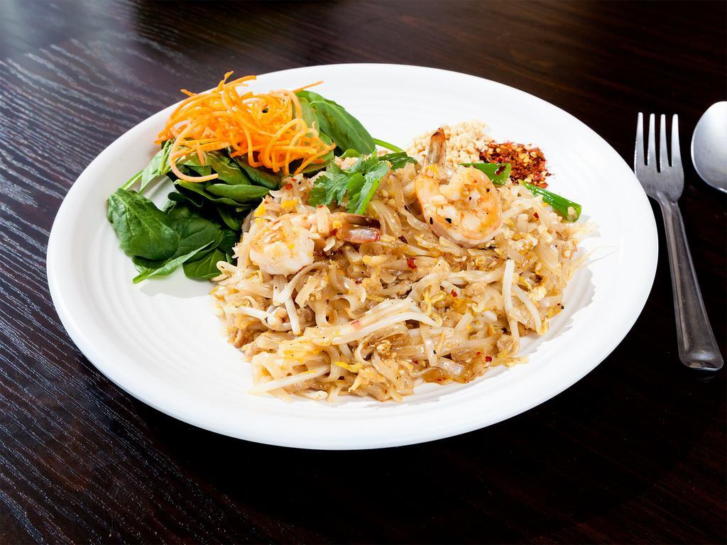 Bangkok Pad Thai · Thai style spicy pan-fried rice noodles with ground chicken, shrimp, fried tofu, egg, green onions, bean sprouts, crushed peanuts and dried chili.