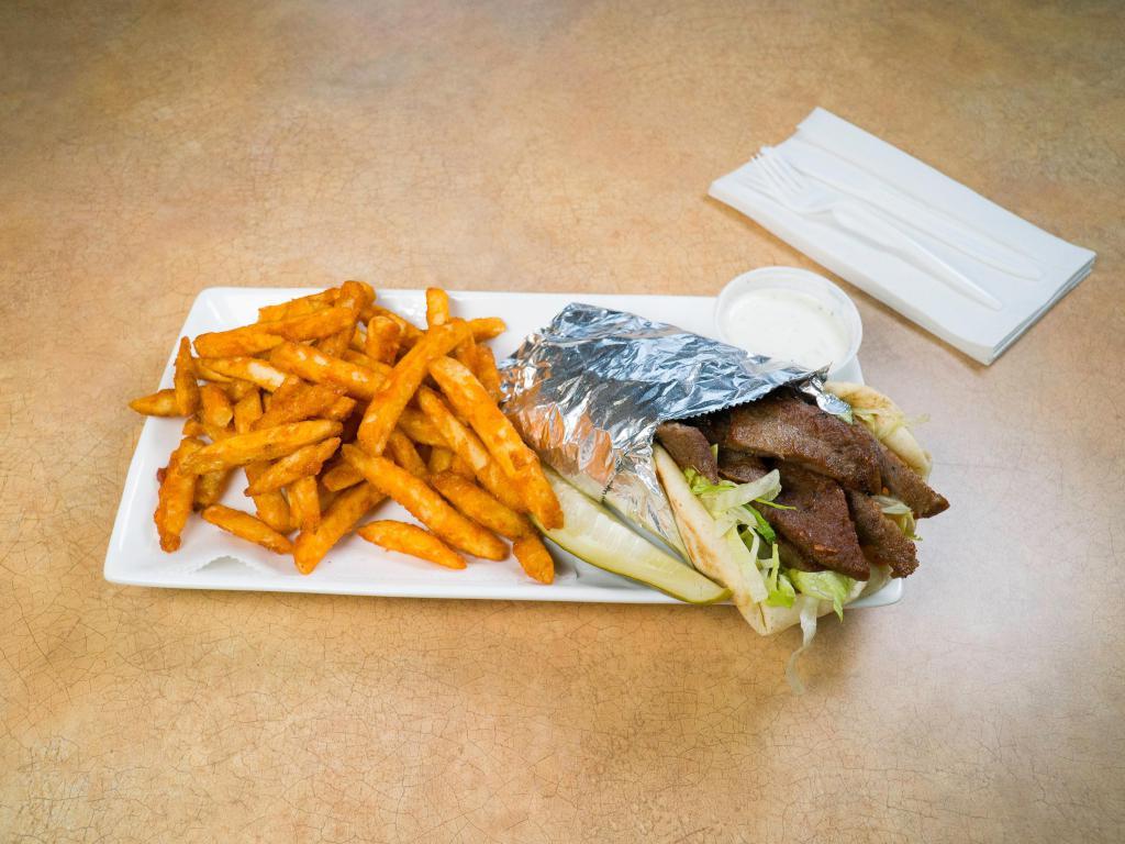 Gyro Pita · Lamb and beef with lettuce, tomato and mayo. Served with freshly baked bread, chips and a pickle on the side.