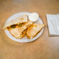 Quesadillas · One large flour tortilla stuffed with Monterey Jack and cheddar cheese and your choice of fi...