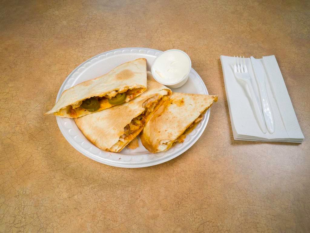 Quesadillas · One large flour tortilla stuffed with Monterey Jack and cheddar cheese and your choice of filling chicken ,steak, cheese . Served with sour cream.
