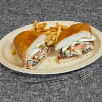 Torta  · Choice of meat, lettuce, queso fresco, tomato, beans, mayo, onions, and pickled jalapenos.
