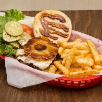 The Hawaiian Burger · Drummer burger with pineapple ring, Swiss cheese and teriyaki sauce on toasted bun. Fresh le...