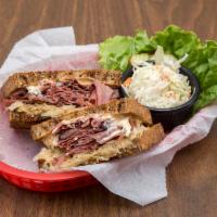 Pastrami Reuben · Hot pastrami on grilled rye with 1000 Island dressing, sauerkraut and melted Swiss cheese. S...