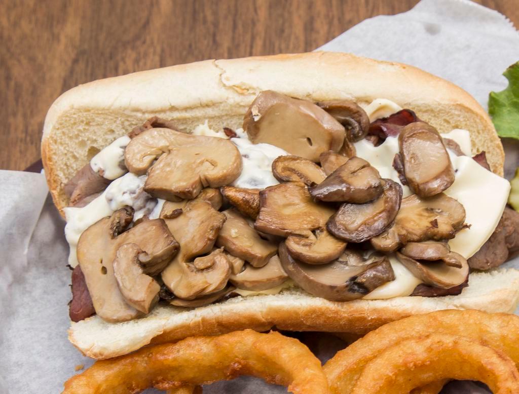 Philly Cheese Steak · Hot roast beef smothered with sauteed onions and bell peppers topped with melted Swiss cheese on toasted French roll. Served with a side of fries, onion rings or slaw. 