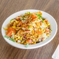 Bhel Puri · A mix of puffed rice, sev, potato, tomato, onion, and sweet spicy chutney served with spicy ...