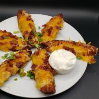 Potato Skins · Fried & topped with cheddar, scallions, bacon served with sour cream