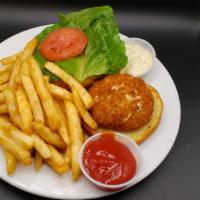 Crab Cake Sandwich · Crab cake, lettuce, tomato, on a bun. Tartar sauce and coleslaw on the side.
