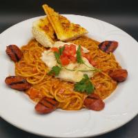 Dirty Chicken Pasta · Grilled chicken and andouille sausage served over spaghetti with a Cajun cream sauce and tom...