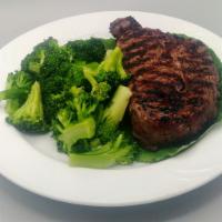Rib Eye Steak · 12 ounce juicy and savory steak, seasoned and seared to perfection.