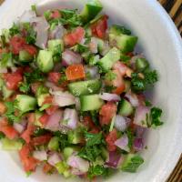 Shirazi Salad · Fresh cucumber, tomatoes, parsley, red onion and dressing.