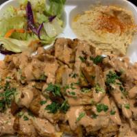 Chicken Shawarma Plate · Served with rice, hummus, salad and pita bread. Drizzled with our homemade sauce.