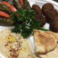 Veggie Plate · Served with 3 pieces of Falafel, 3 Grapeleaves, Hummus, Baba Ghanoush, Salad, and Pita Bread.