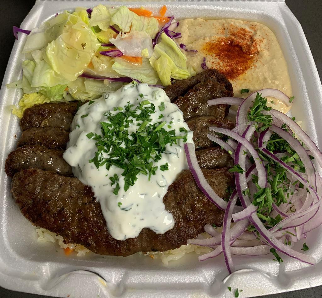 Gyro Plate · Served with Rice, Salad, Hummus meat topped with Jajek and pita bread 