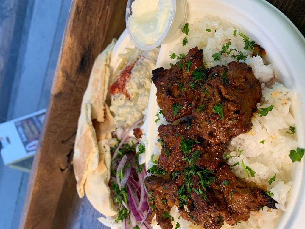 Beef Kabob · Served with hummus, salad, onions, grilled tomato, grilled jalapeno and pita bread.